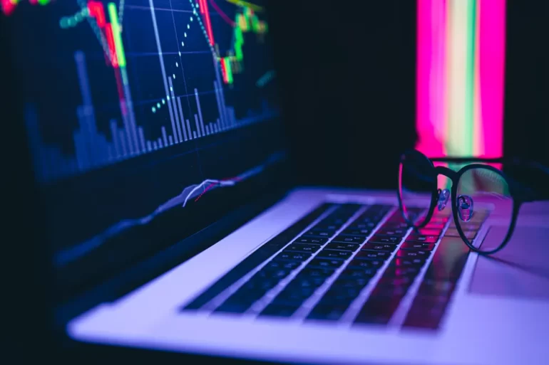 stock market graph financial data on an electronic board on a laptop screen scaled